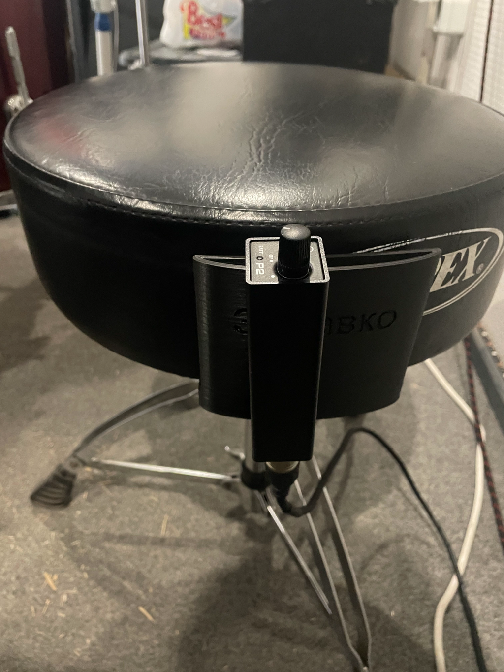 In ear holder for drum throne