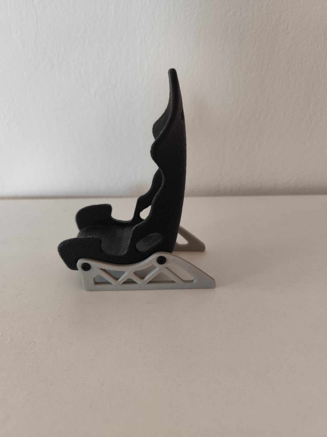 Racing seat phone stand
