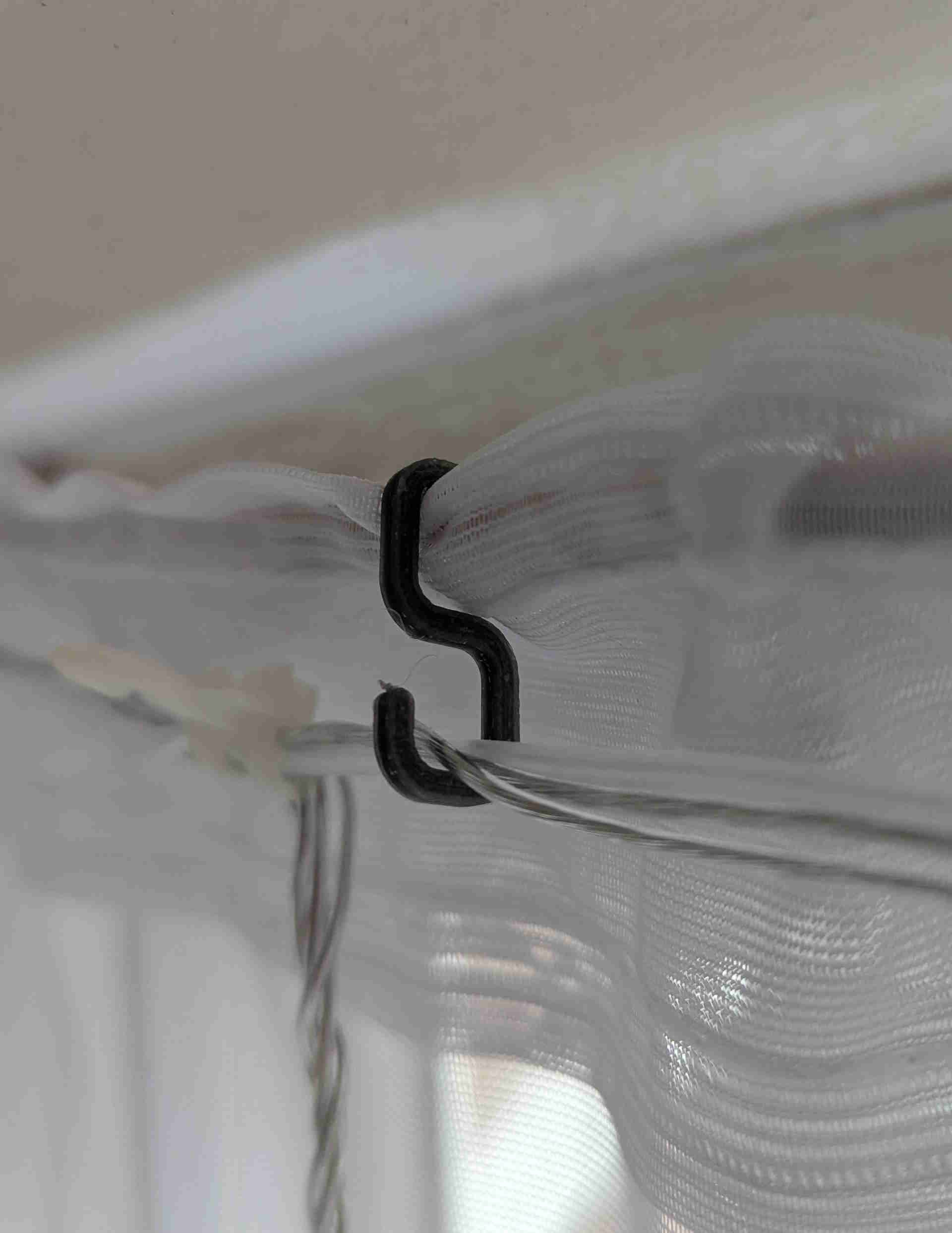 Small hook for hanging lights on net curtain rail