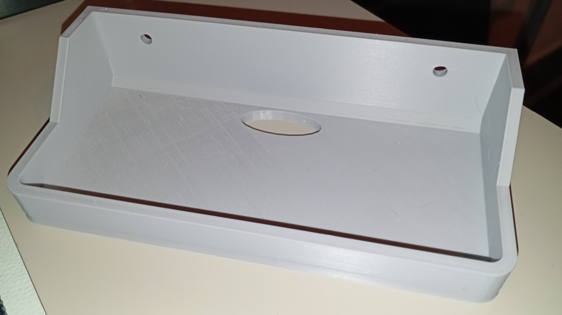 Small shelf with hole for electrical cord