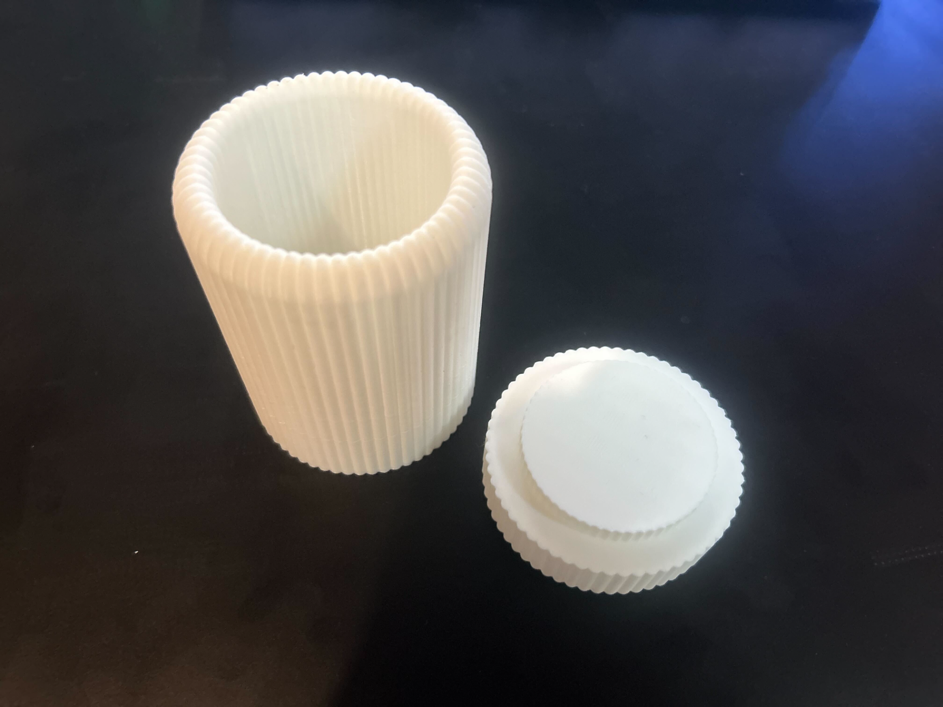 Toothbrush cup with removable bottom
