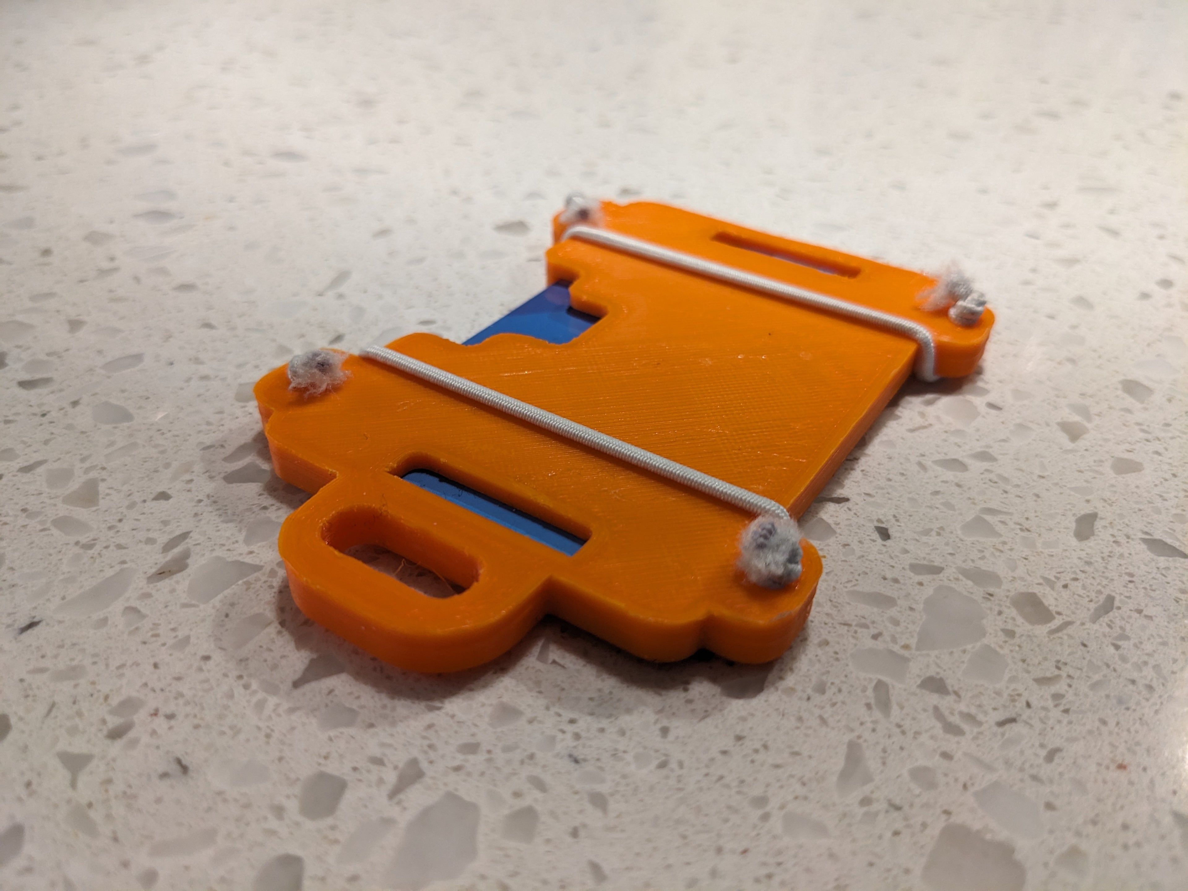 Badge holder with keyring/lanyard hole and holes for elastic