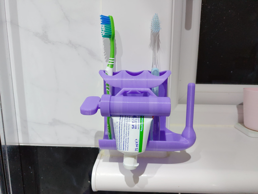 Toothpaste squeezer and toothbrush holder