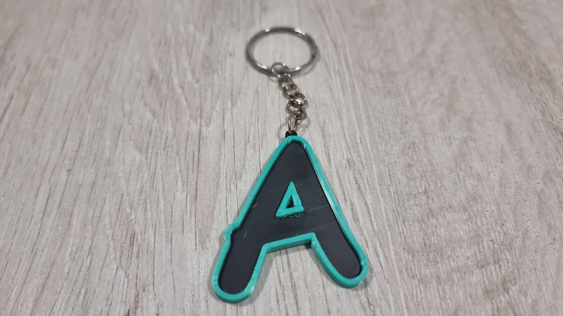 Letters for keychains with raised edge