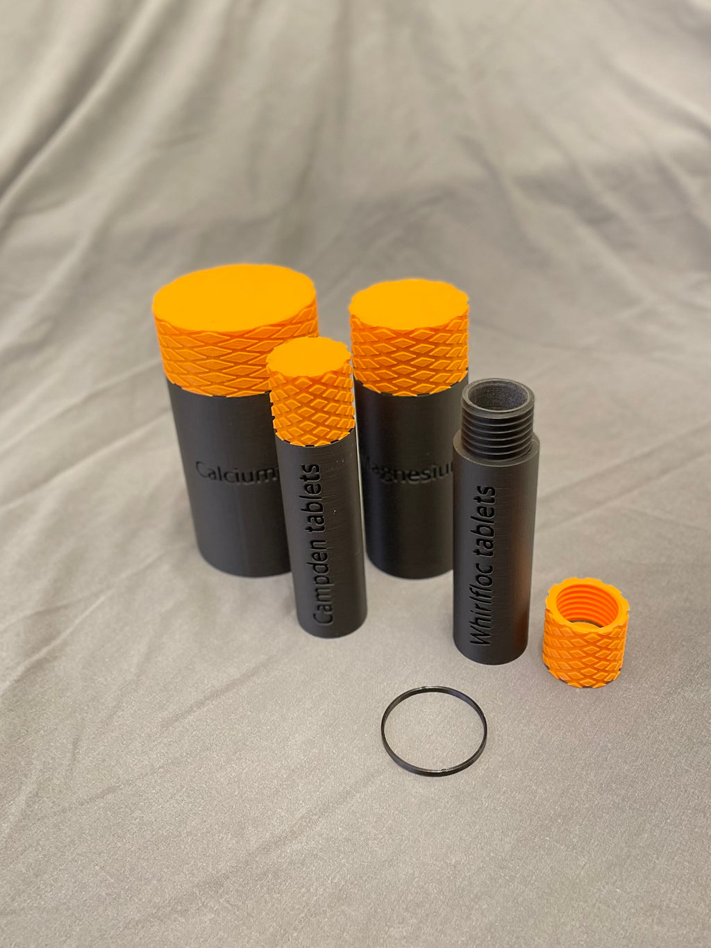 Screw top containers with TPU seal, embossed label
