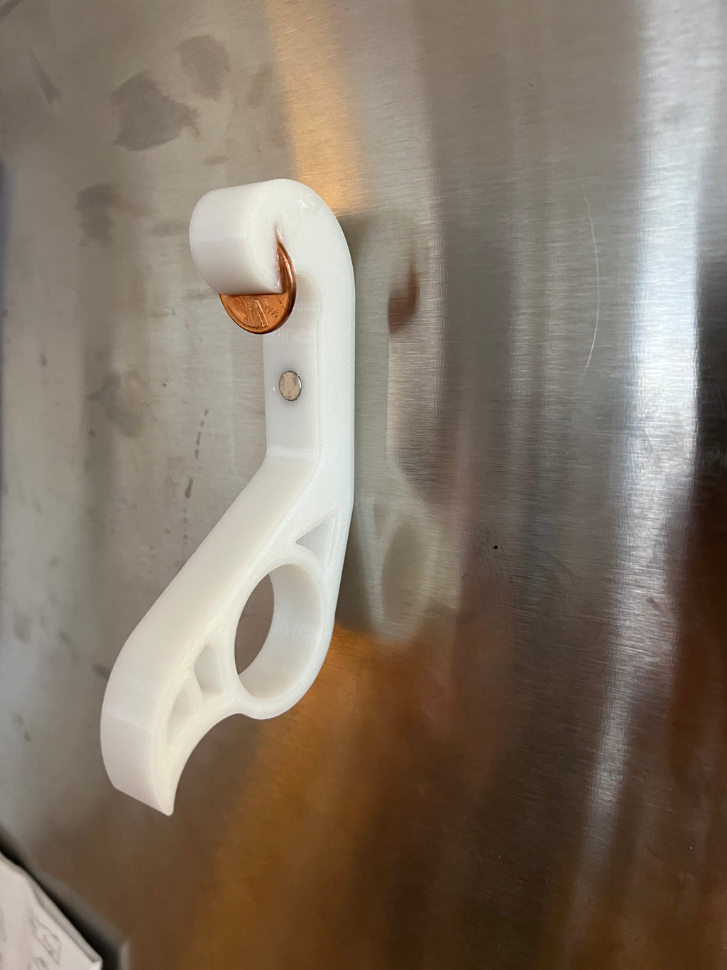 The Penny Popper: A one handed magnetic bottle opener for your fridge