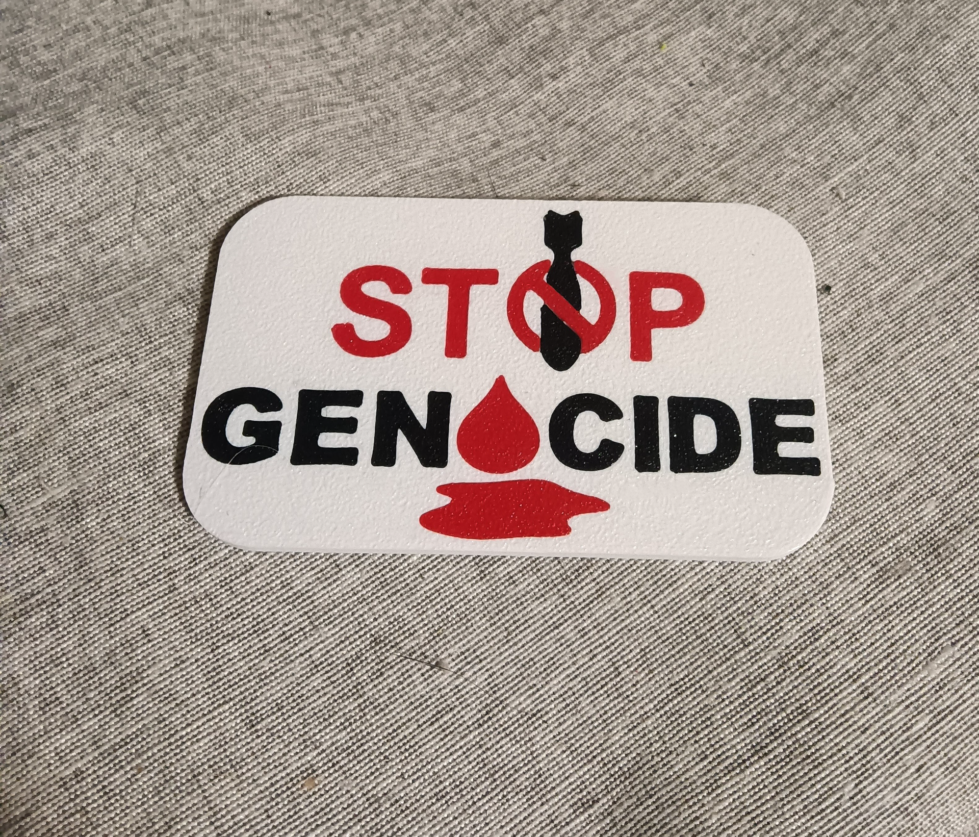 STOP GENOCIDE badge
