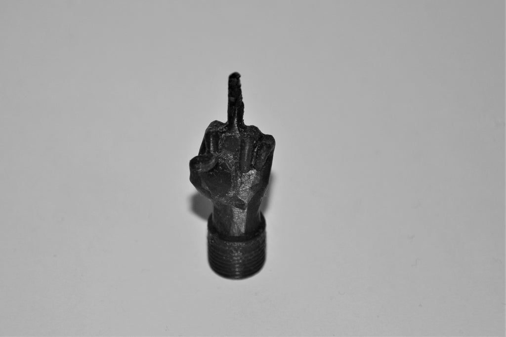 Middle finger schrader valve cap