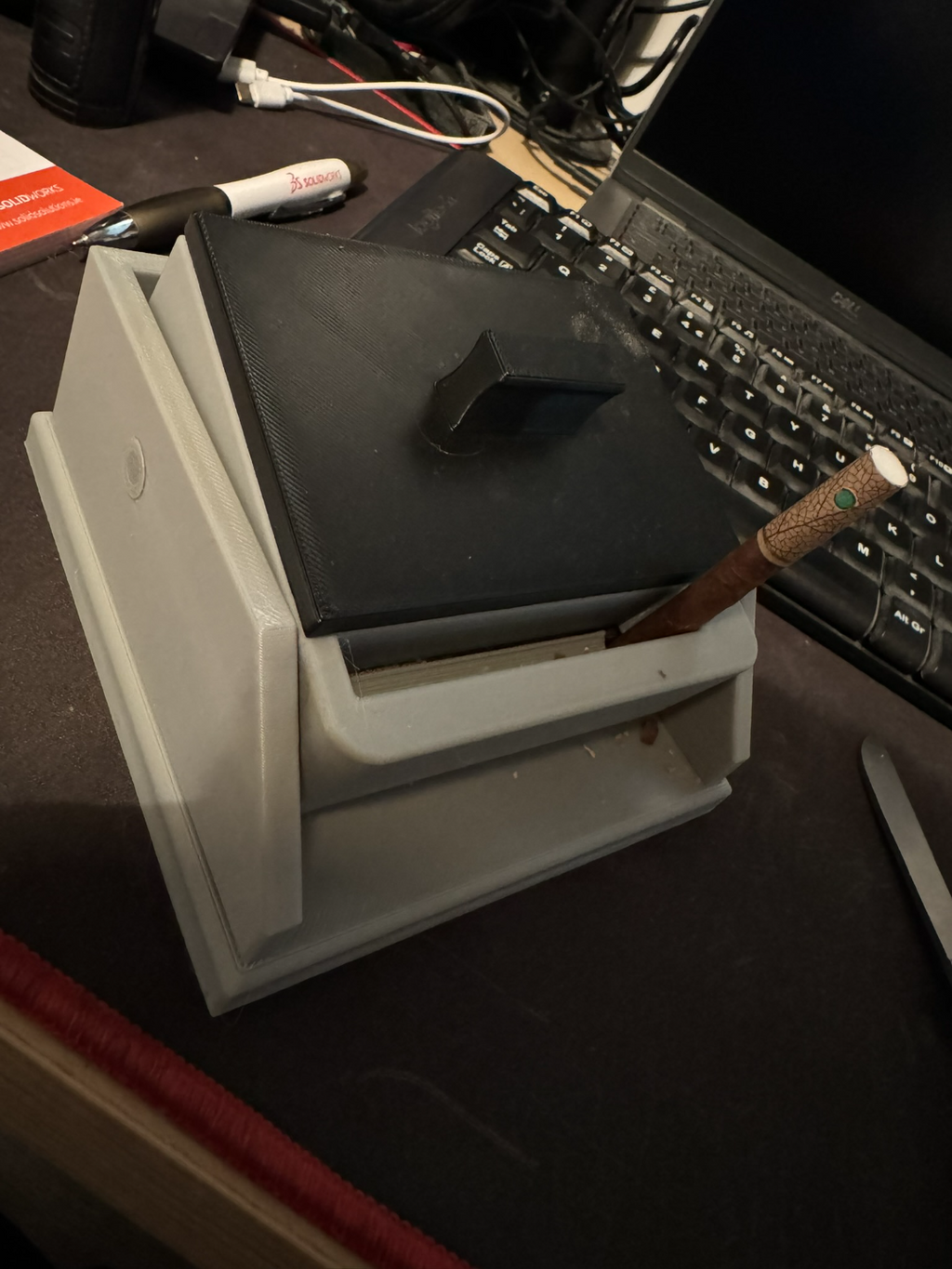 Cigarette box with lift feature