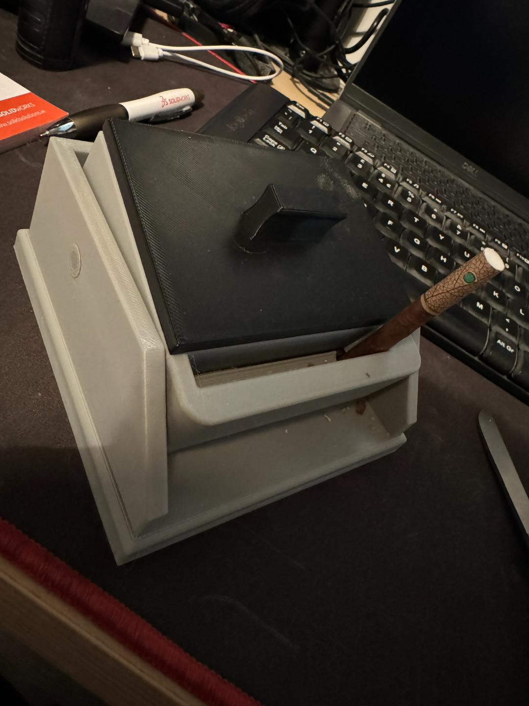 Cigarette box with lift feature