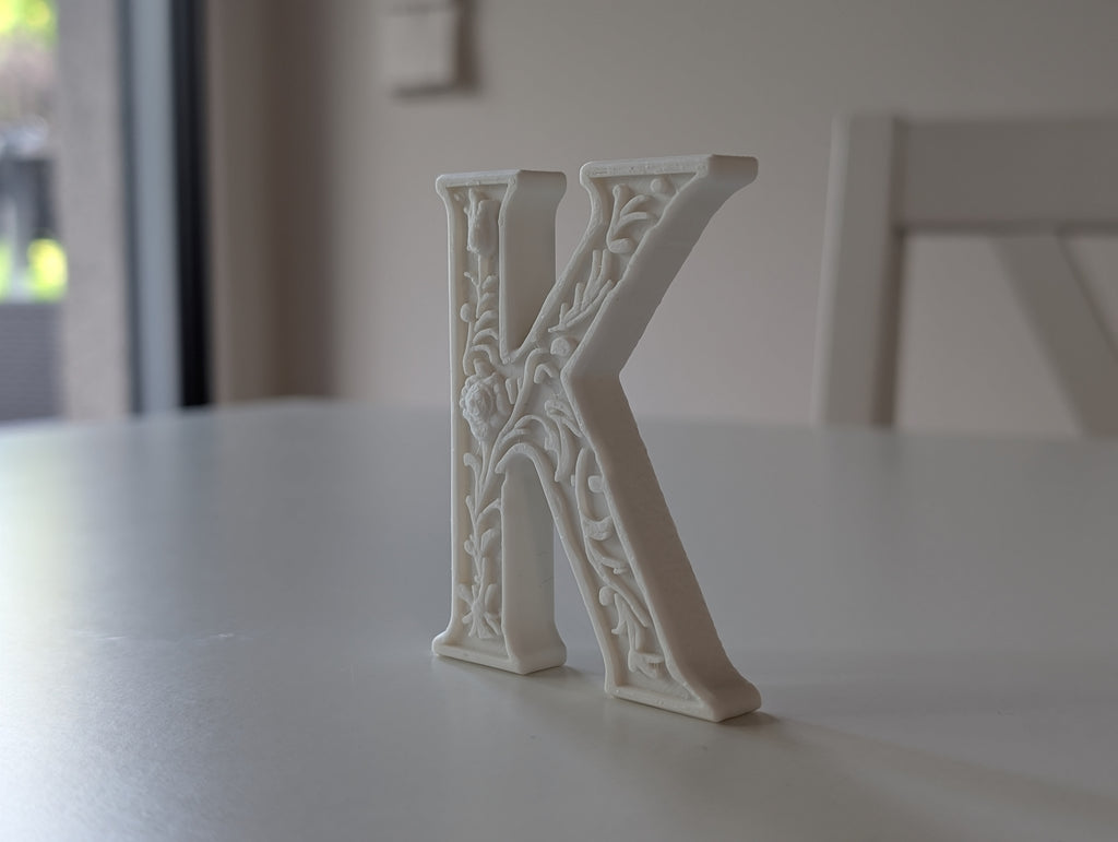 Standing Letter K in a Gypsum Floral Style