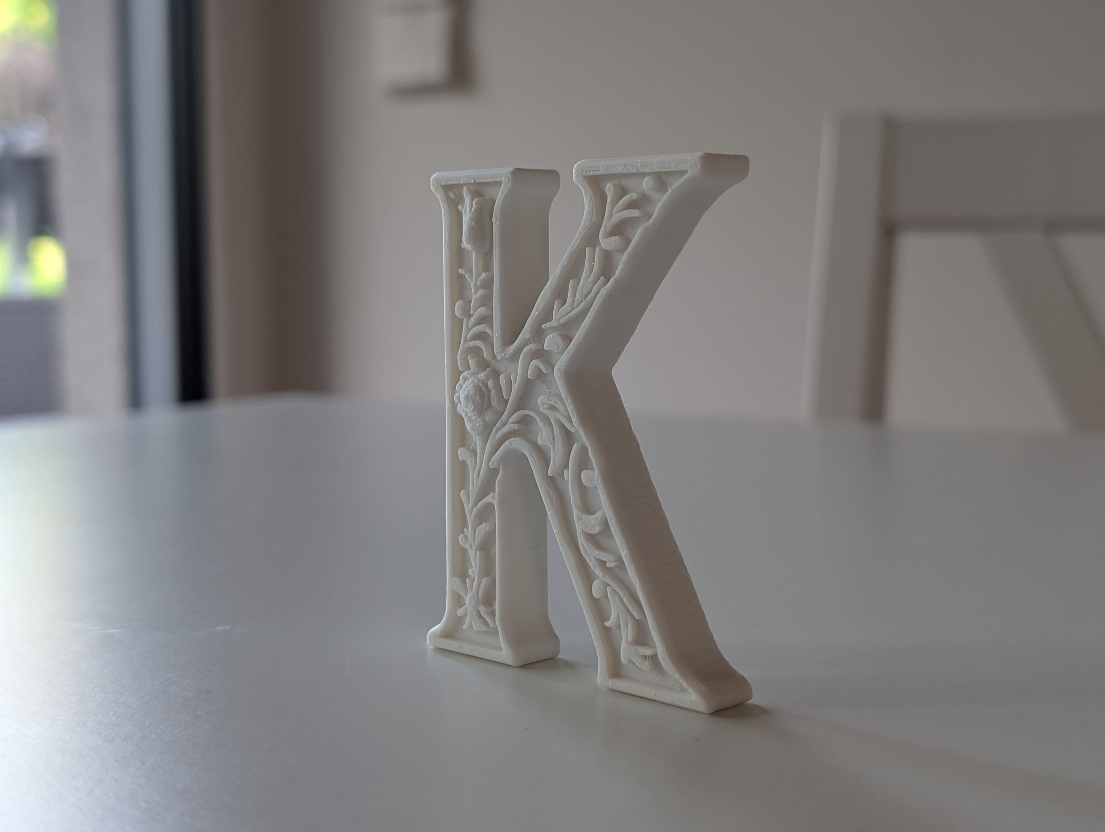 Standing Letter K in a Gypsum Floral Style