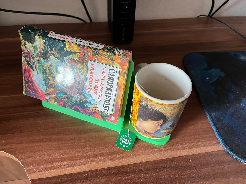 Holder for a read book and a mug of tea