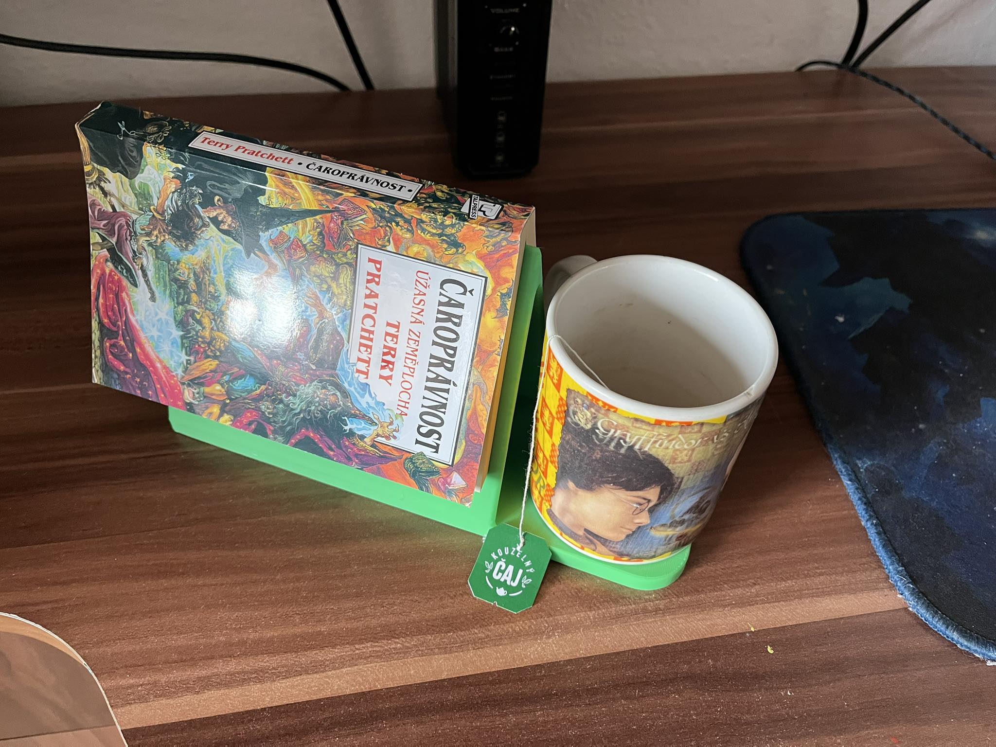 Holder for a read book and a mug of tea