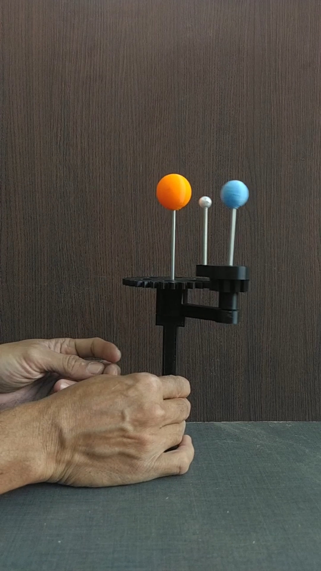 Handheld model of Sun Earth and Moon