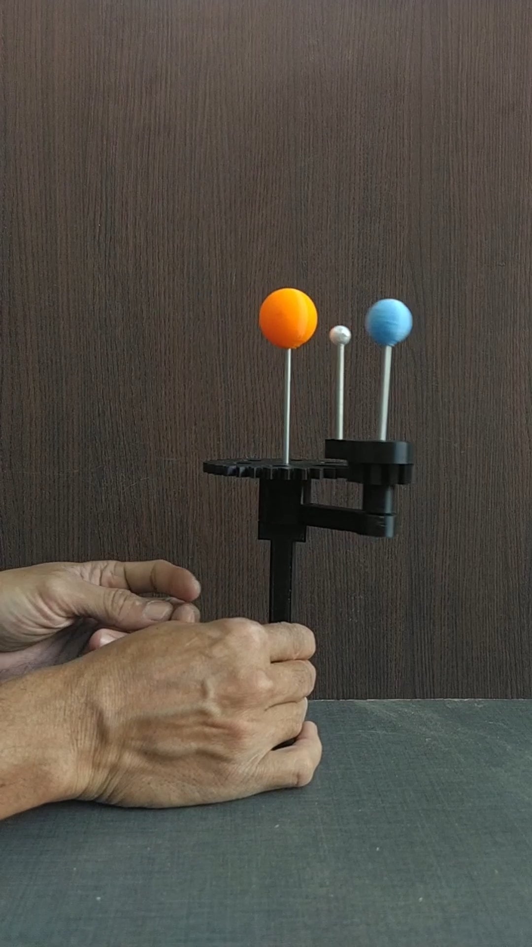 Handheld model of Sun Earth and Moon