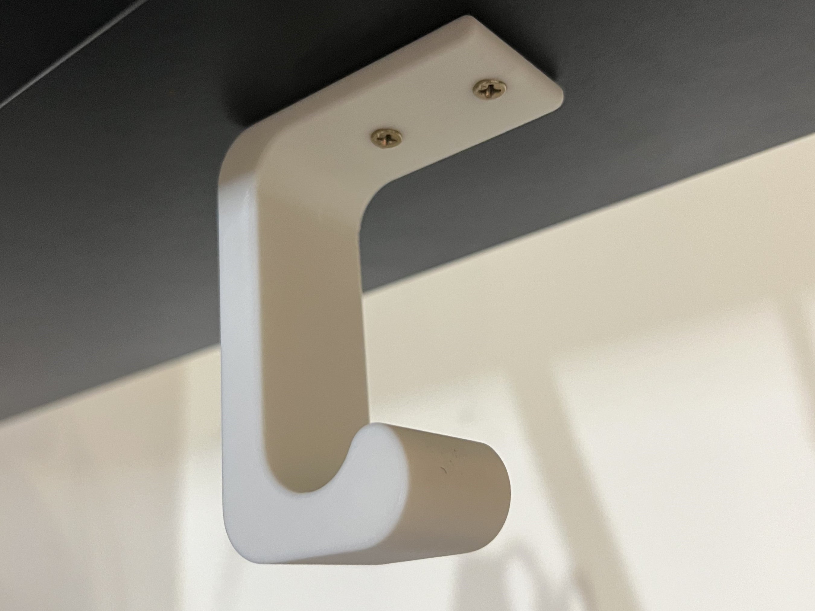 Under-desk headphone holder
