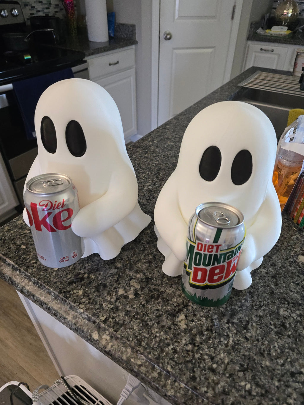 Ghosty holding soda can