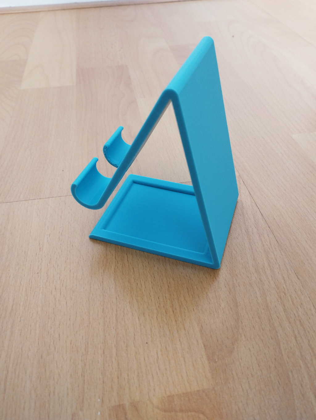 phone holder with charging cable hole