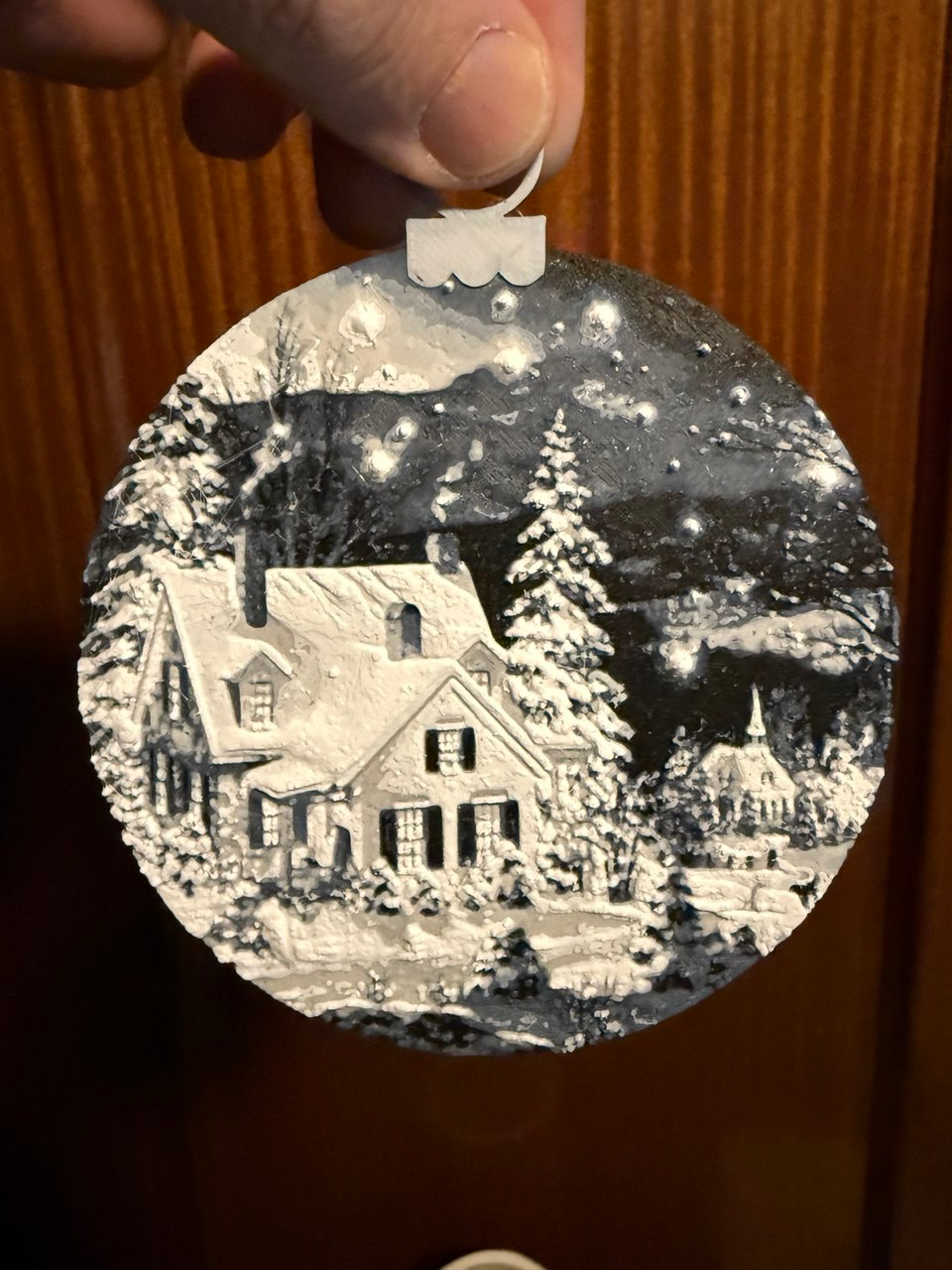 Christmas ball of a snowy night landscape