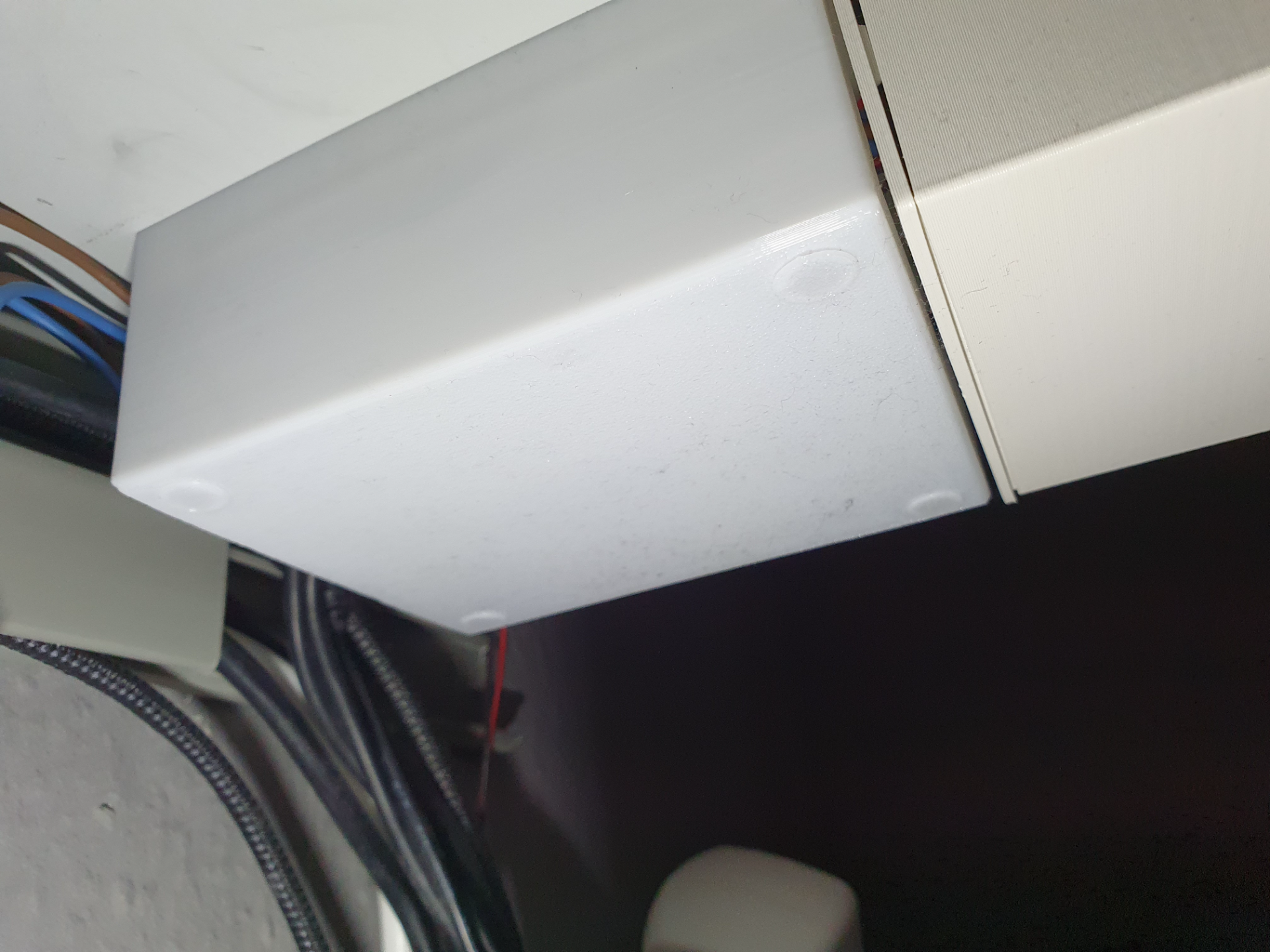Screw-mounted under-desk cable box