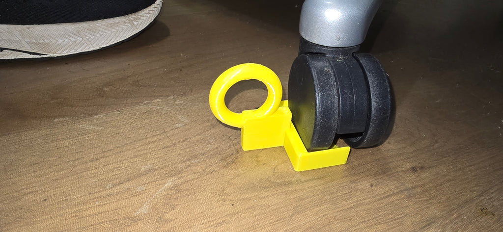 Desk chair wheel chock