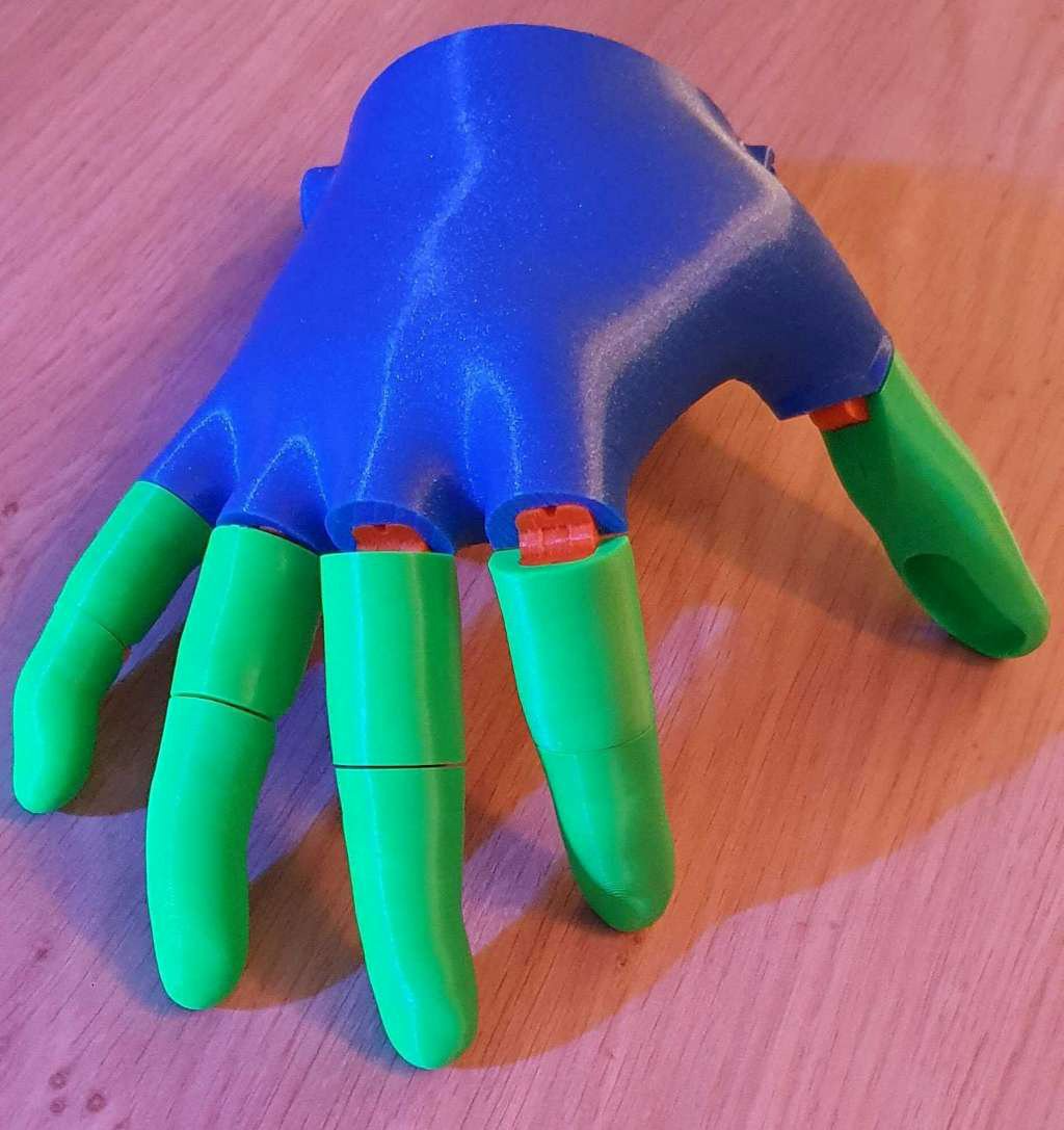 Voice activated low cost motorized hand