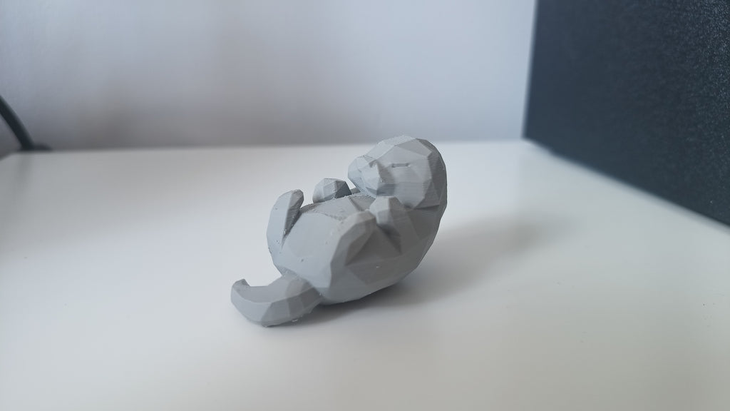 Low Poly Sleeping Otter Figurine