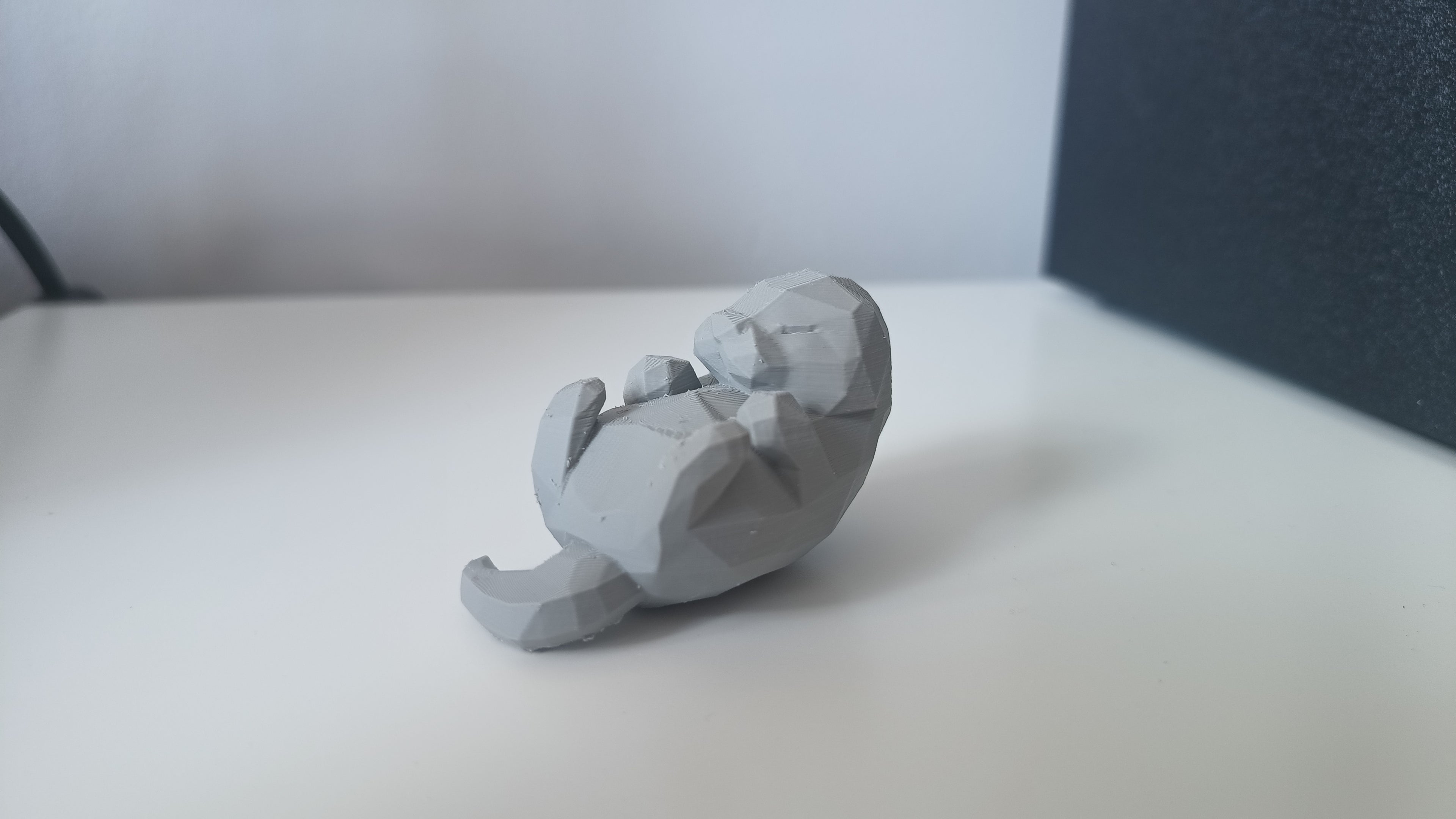 Low Poly Sleeping Otter Figurine