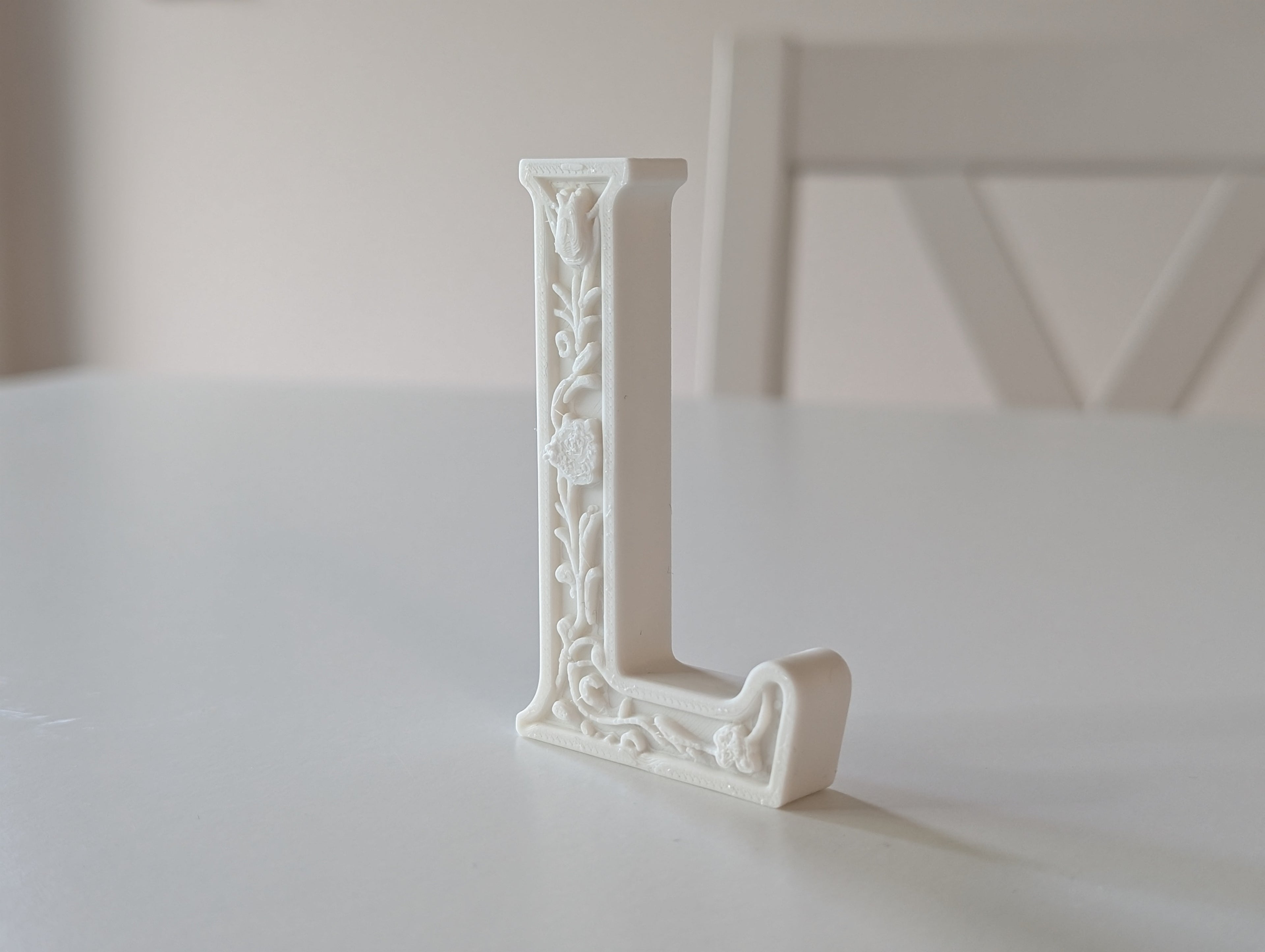 Standing Letter L in a Gypsum Floral Style
