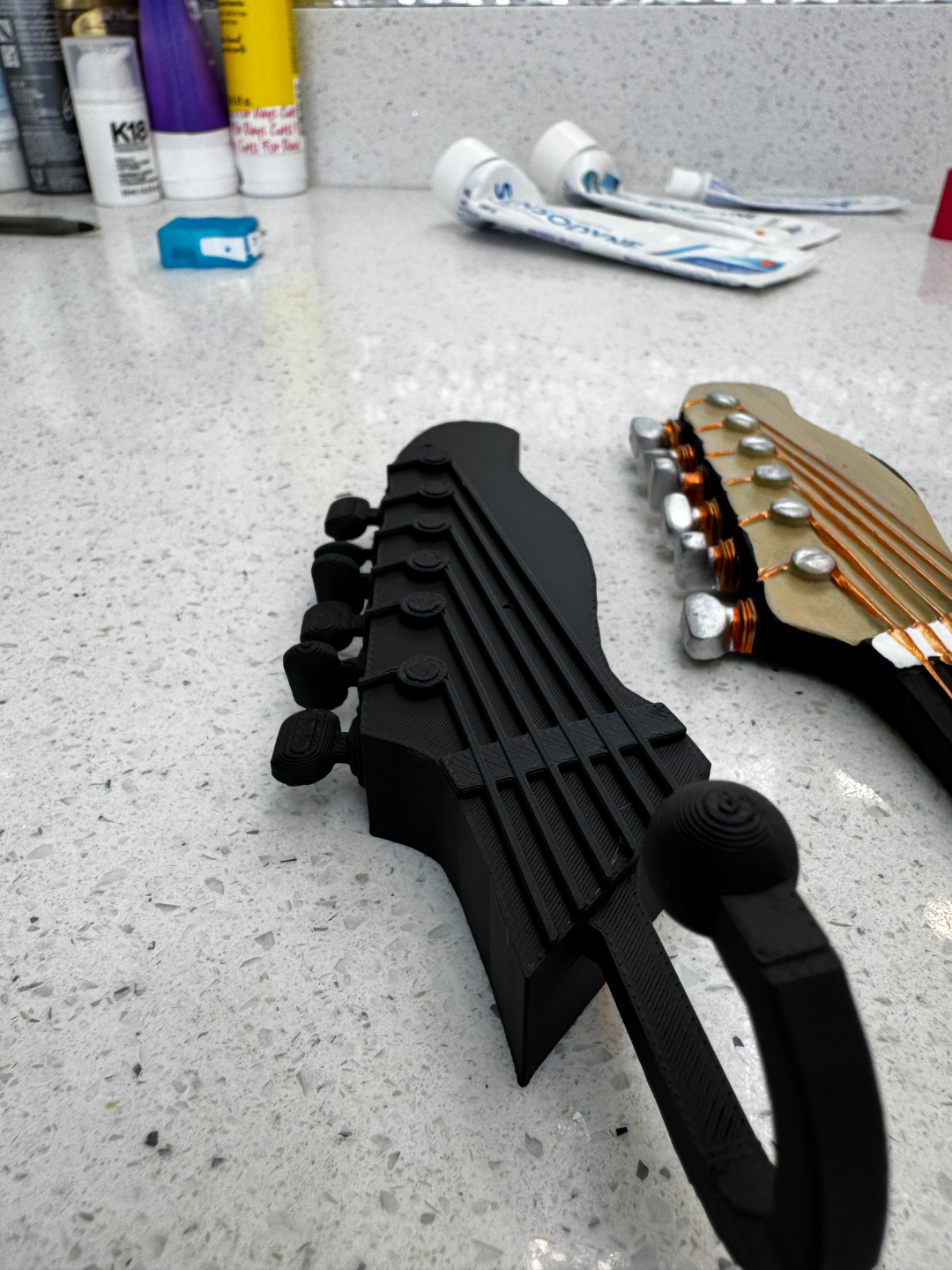 Guitar shaped hanger