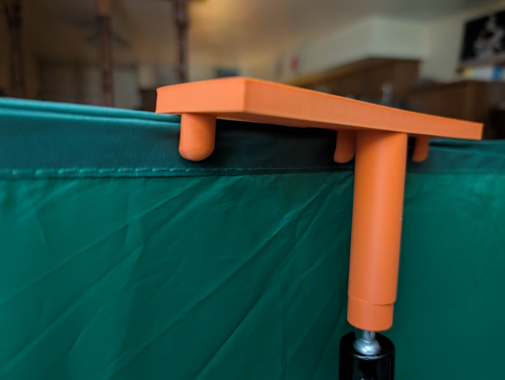 Tripod mounted green screen holder clip