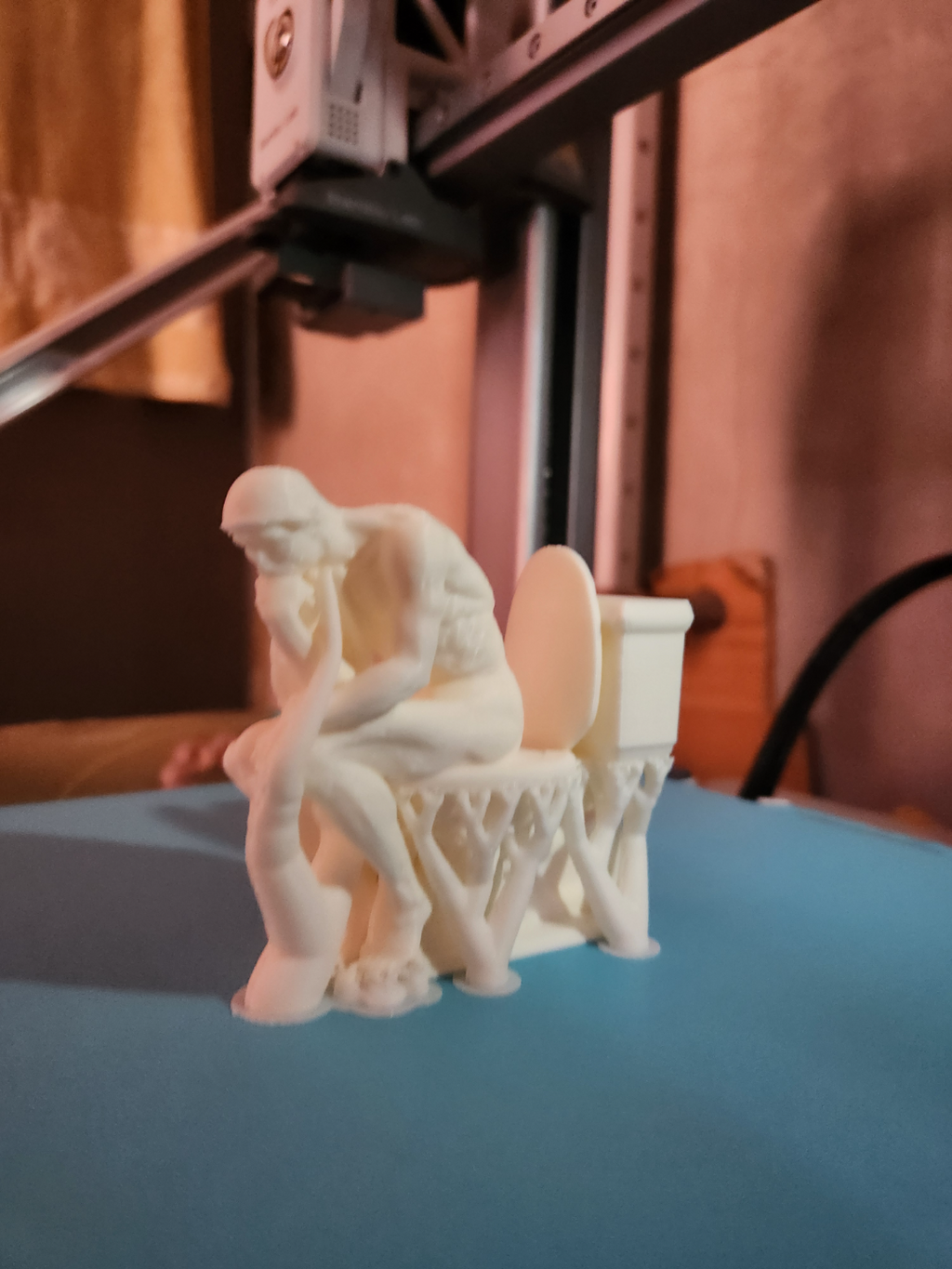 the Thinker on the toilet