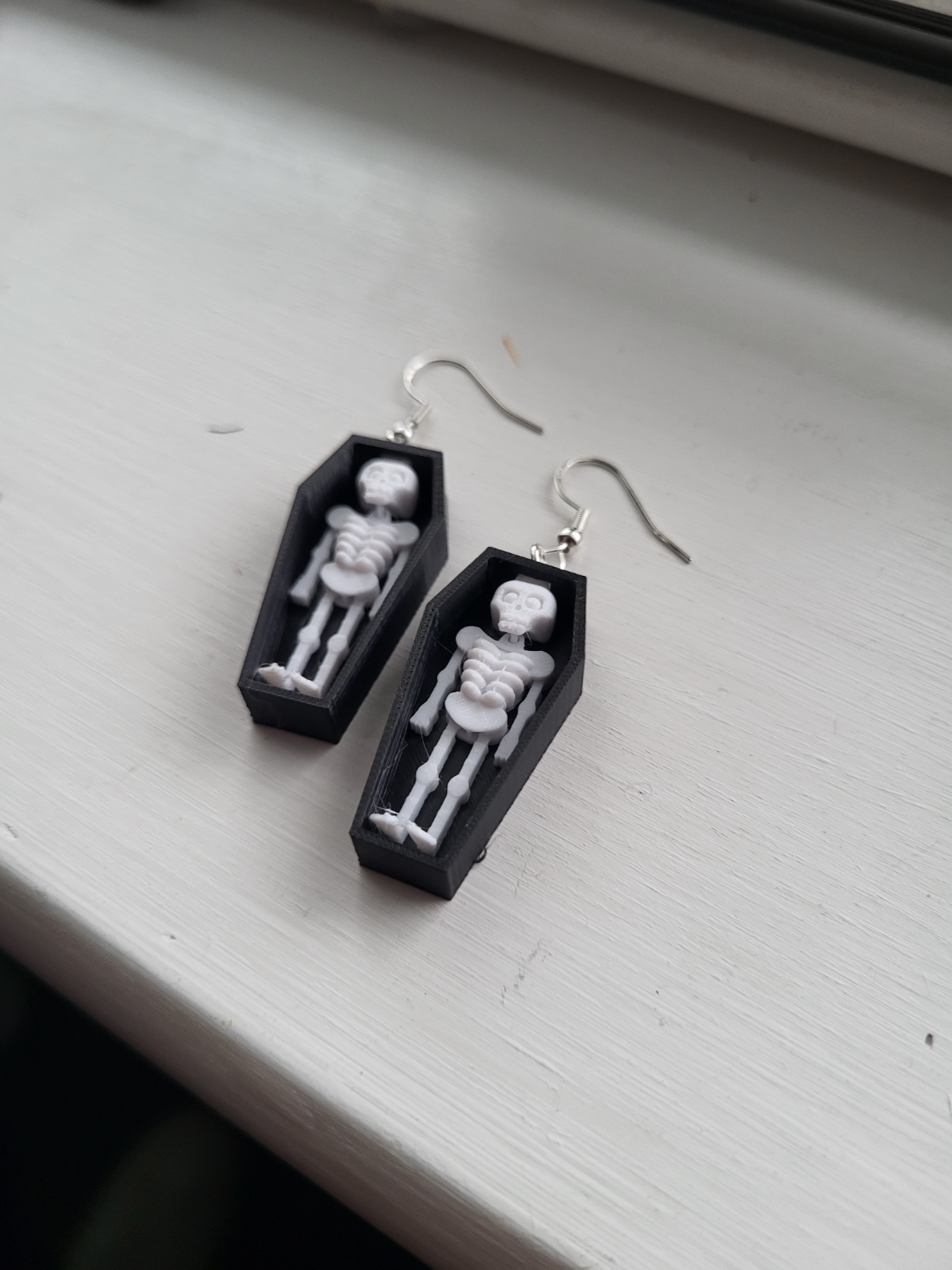 skeleton in coffin earring