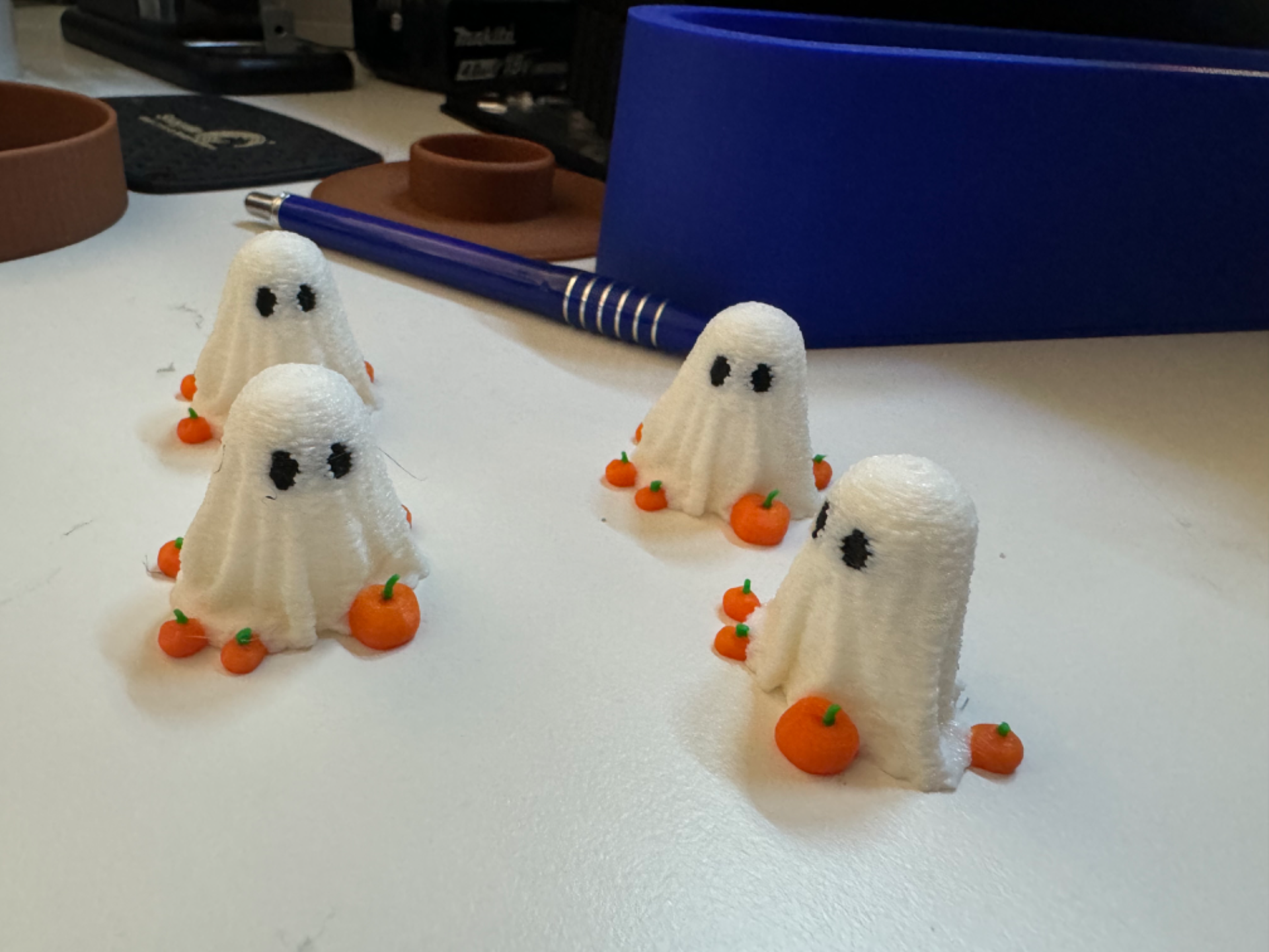 Mini Ghost for Halloween surrounded by pumpkins