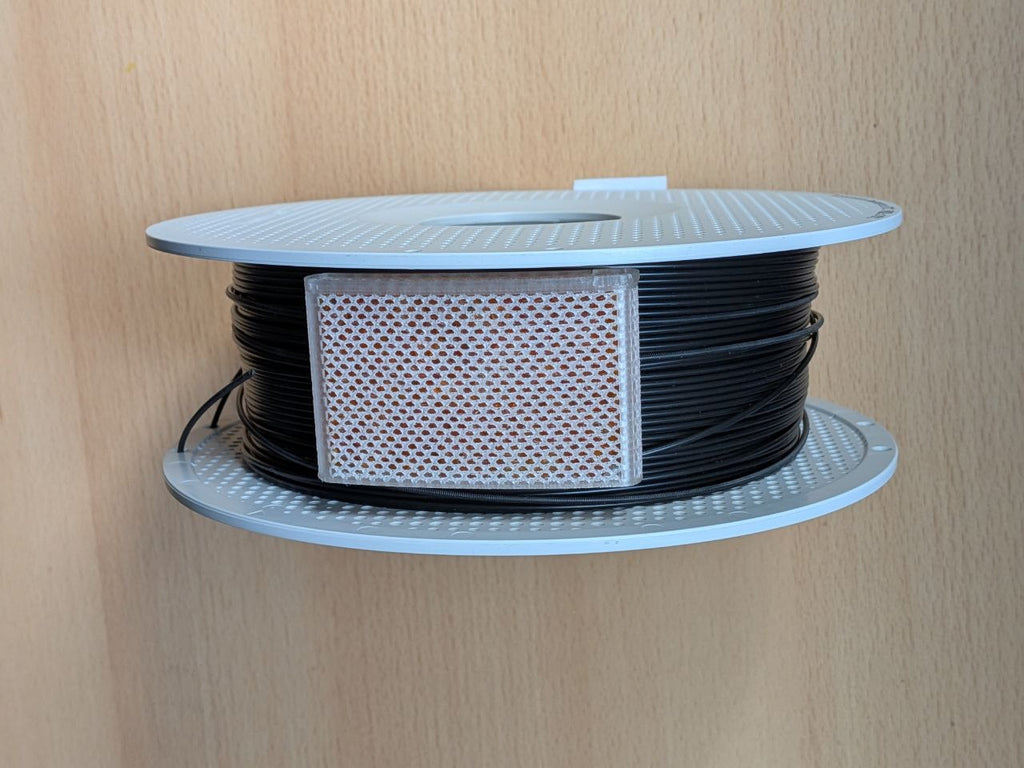 Compact Perimeter Spool Desiccant Container