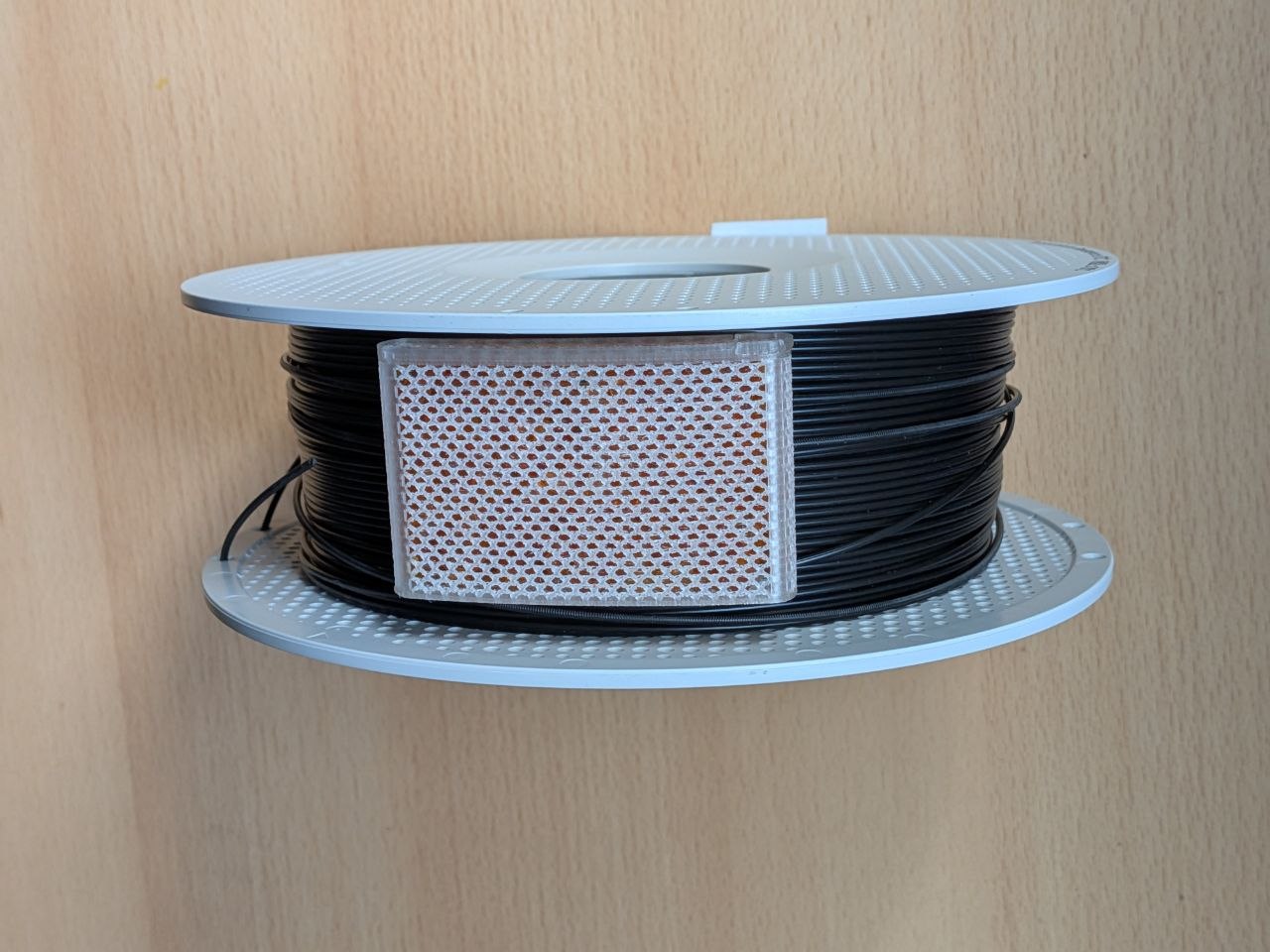 Compact Perimeter Spool Desiccant Container