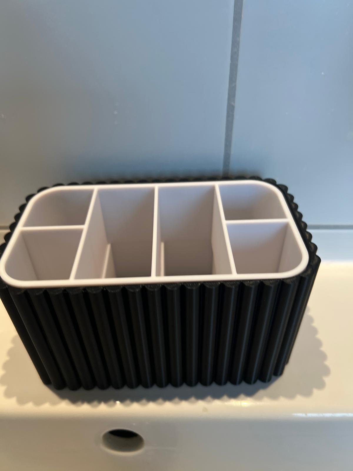 Bathroom toothbrush and toothpaste organiser