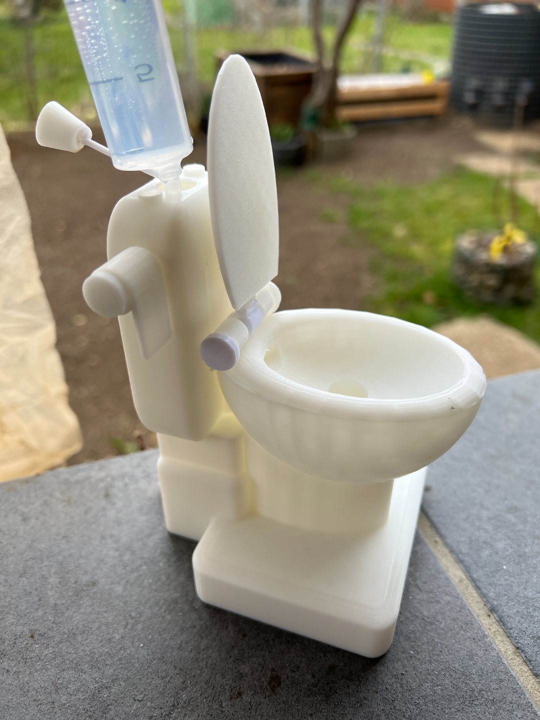 Flushable Toilet Kit - Spits water out the back.
