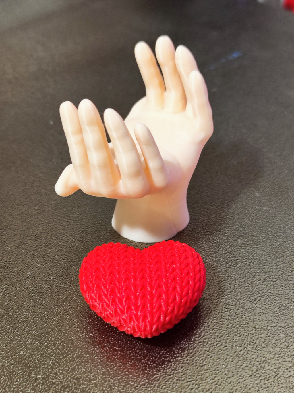 Heart knitted in hands
