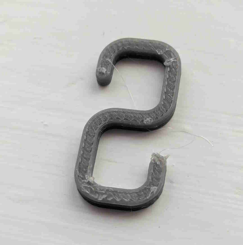 Small hook for hanging lights on net curtain rail