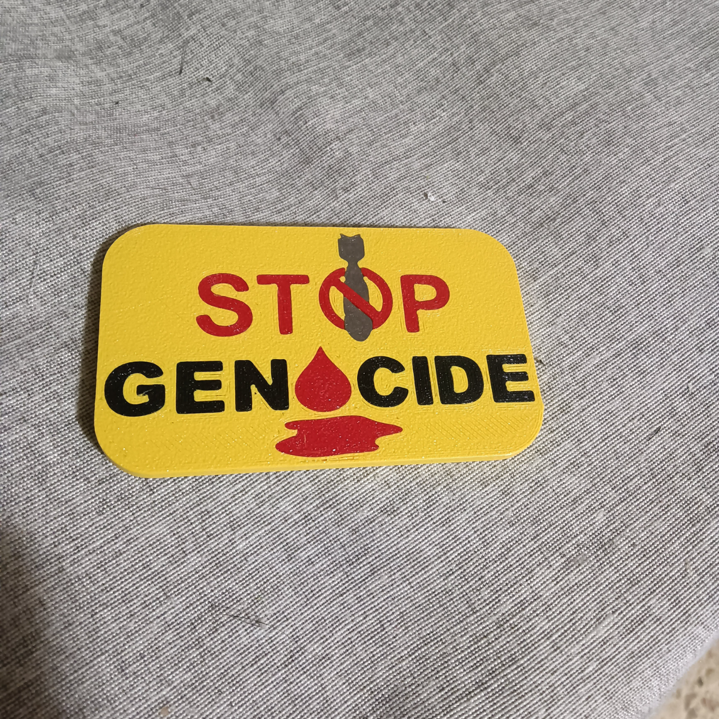 STOP GENOCIDE badge