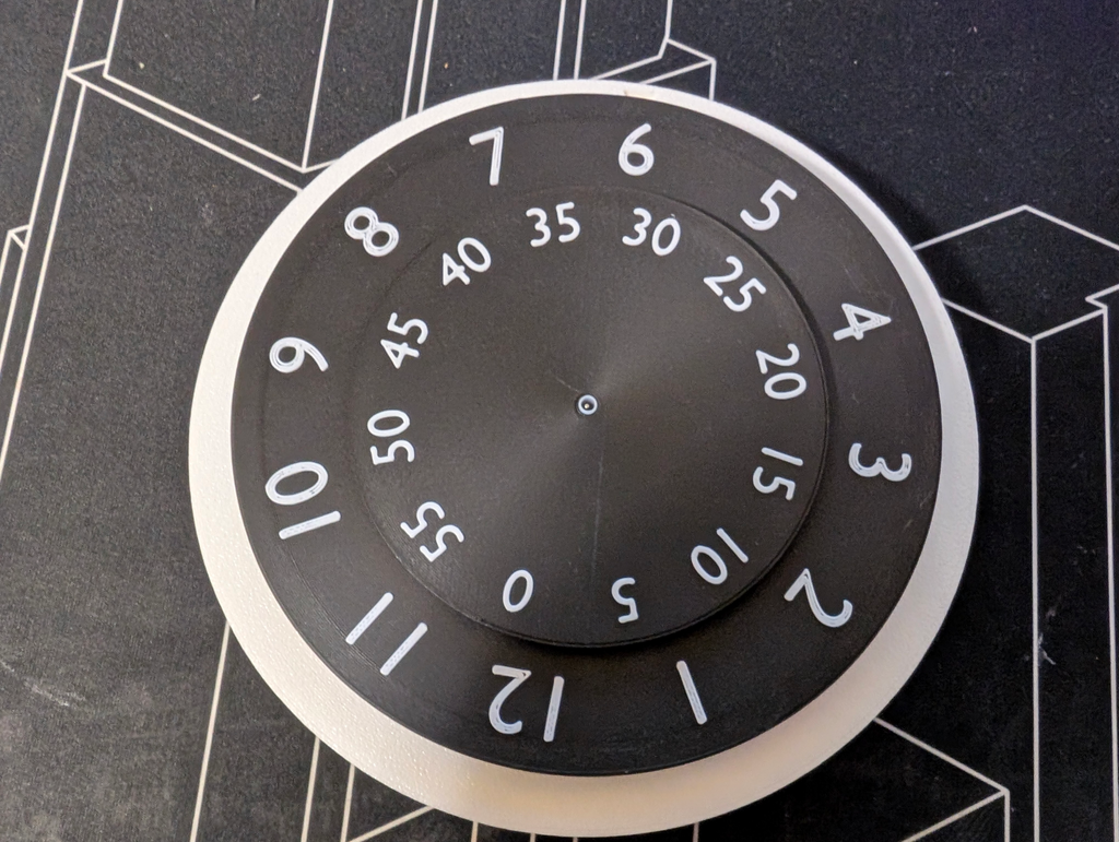 Clock with spinning clockface (AMS)