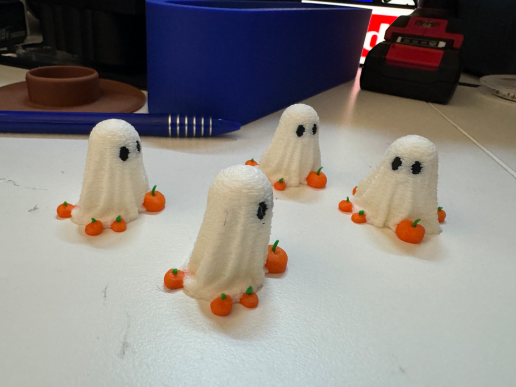 Mini Ghost for Halloween surrounded by pumpkins