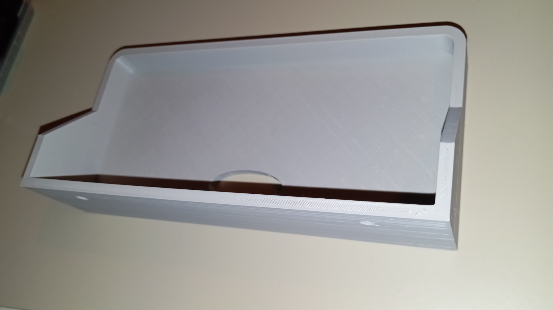 Small shelf with hole for electrical cord