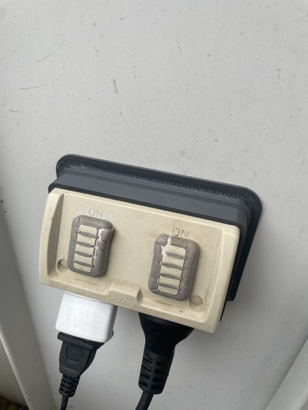 Weather shield for outside power outlet