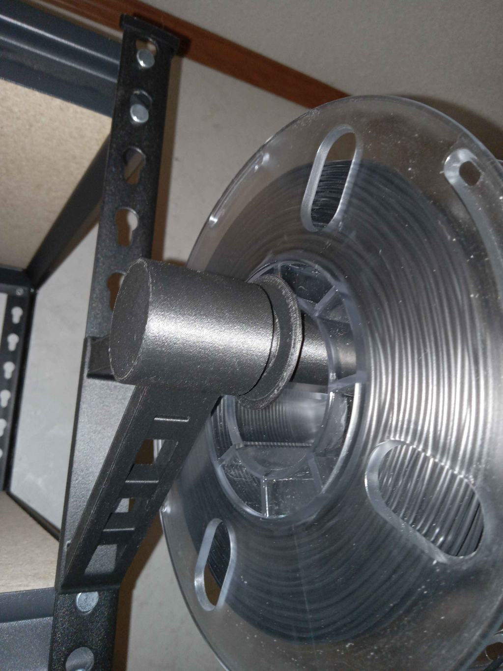 Spool holder for muscle rack/rivet shelving