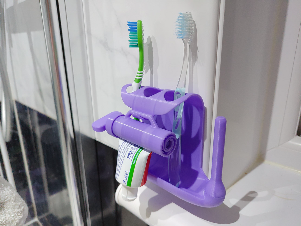 Toothpaste squeezer and toothbrush holder