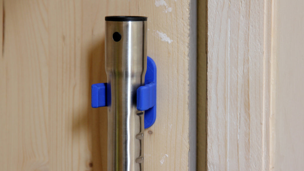 Universal hook for brooms and vacuum cleaners