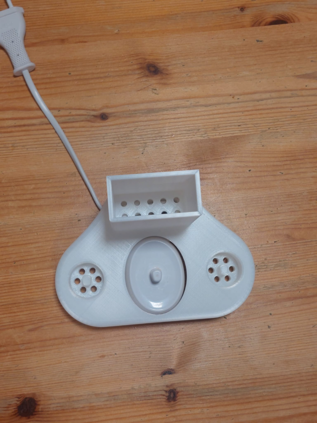 Oral-B toothbrush holder+ cable hiding place.